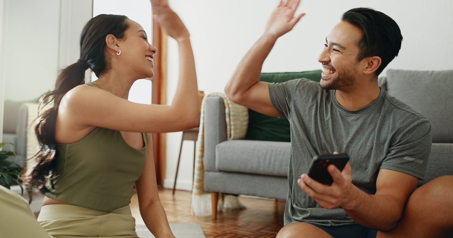 A couple sharing a happy moment at home